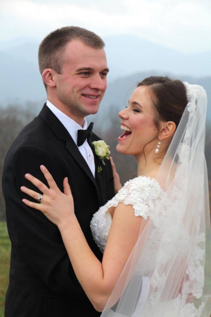 Bride and groom outside on a cloudy day