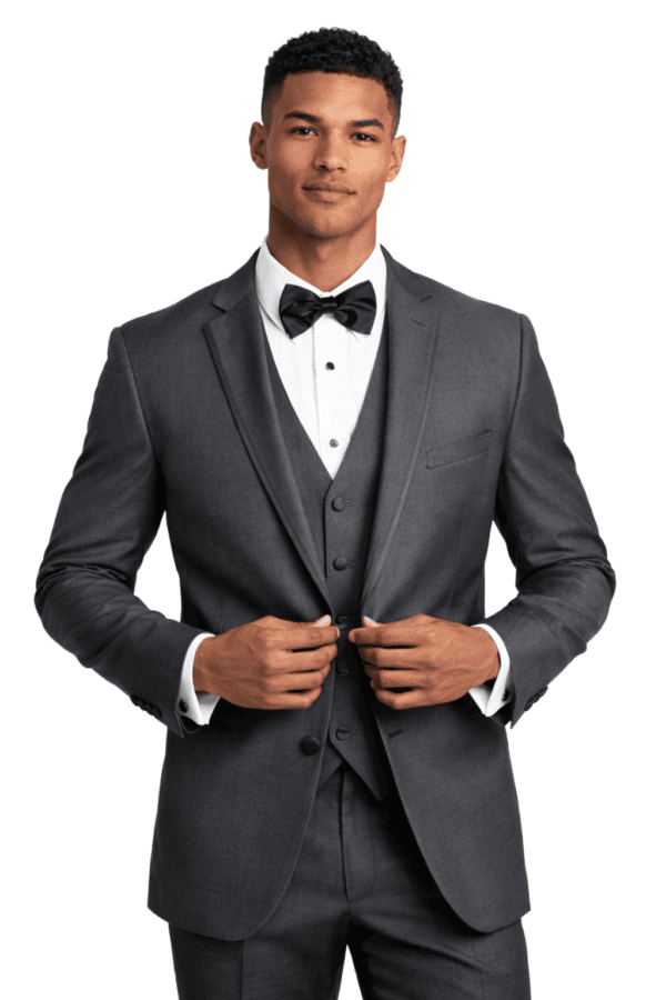 A handsome man poses wearing the Infinity tuxedo rental in steel grey.