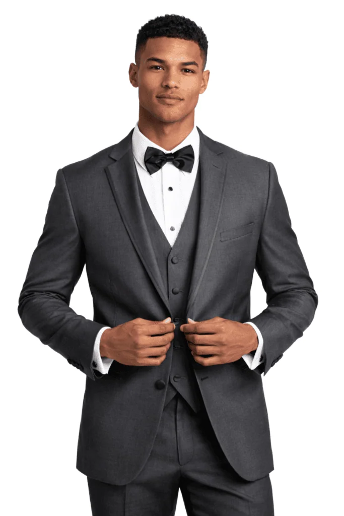 A handsome man poses wearing the Infinity tuxedo rental in steel grey.