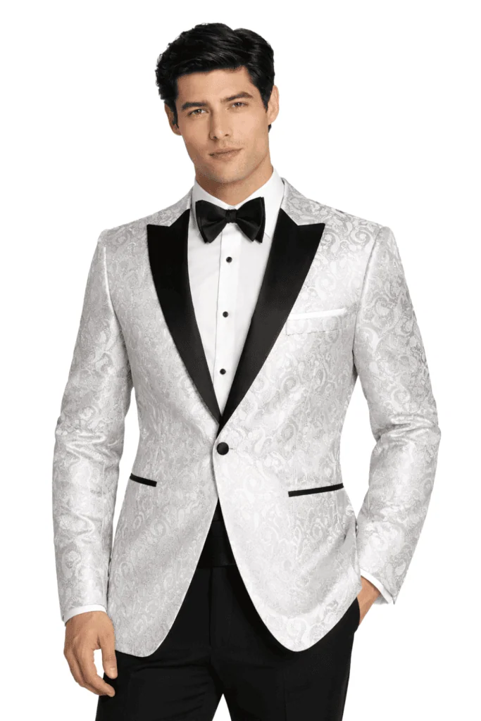 a man wearing a white paisley tuxedo rental