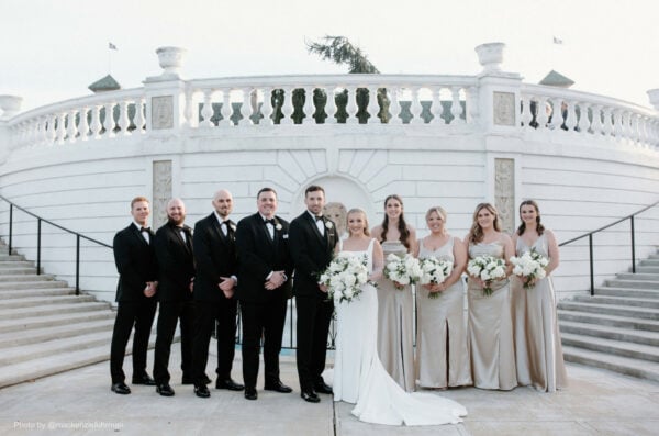 entire wedding party posing together for a group photo