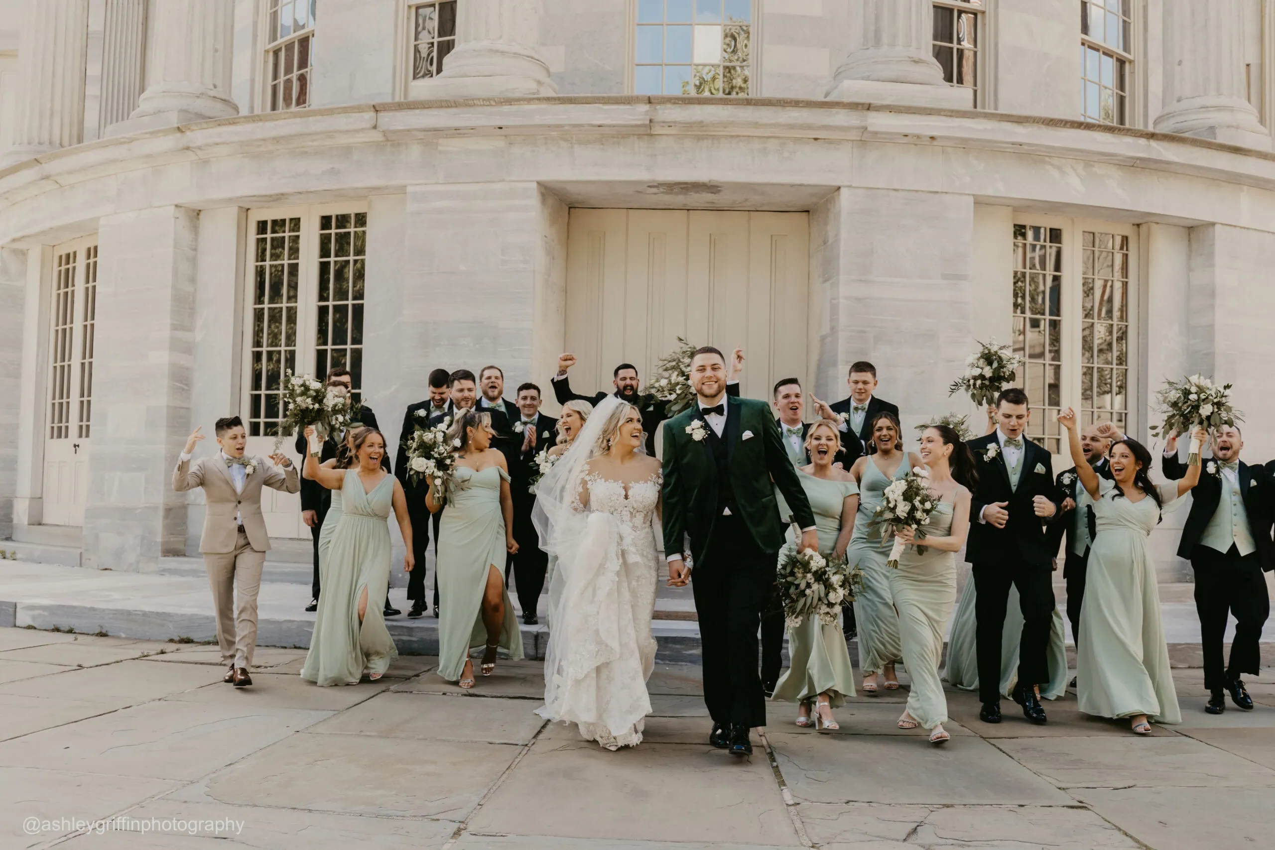 a bride and groom leaving wedding together followed by entire wedding party