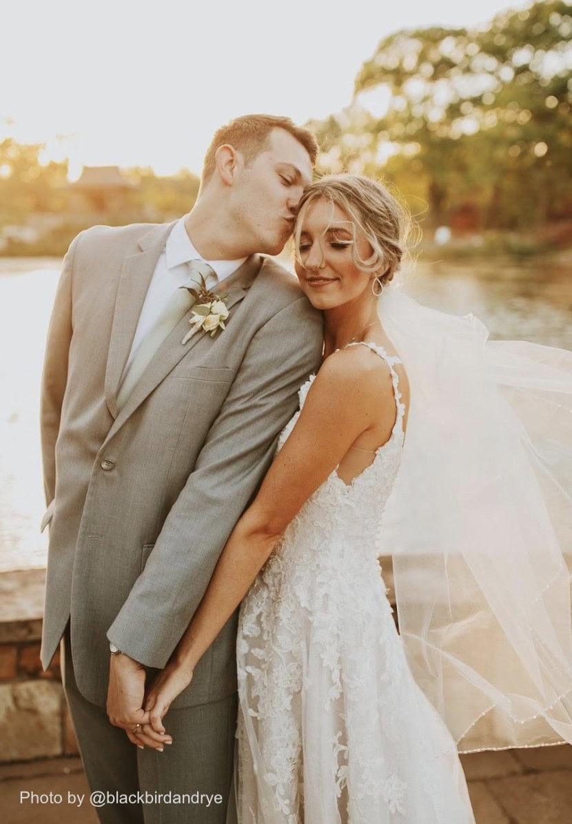 groom wearing a gray tuxedo rental at wedding