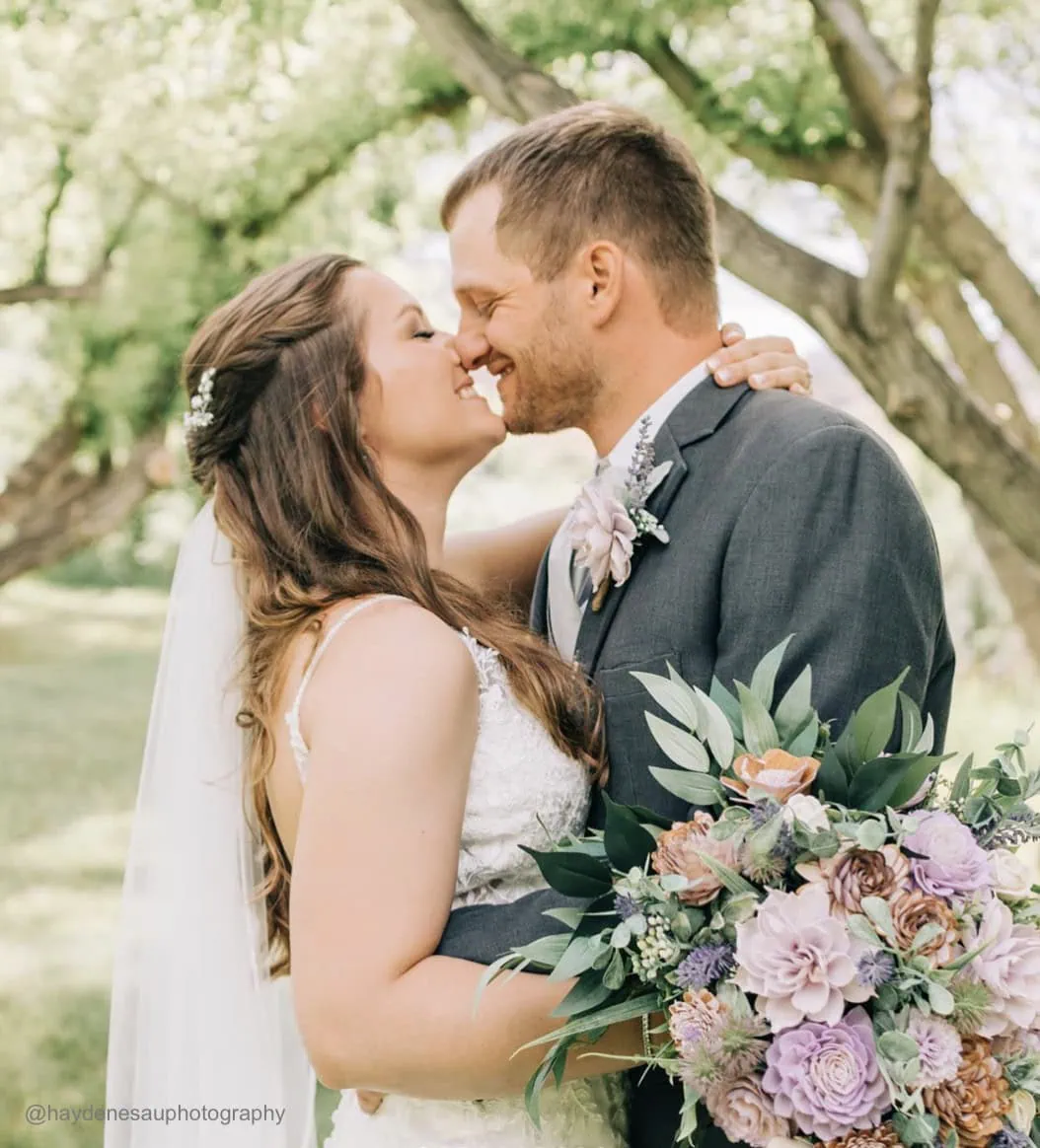 happy wedding couple at outdoor ceremony
