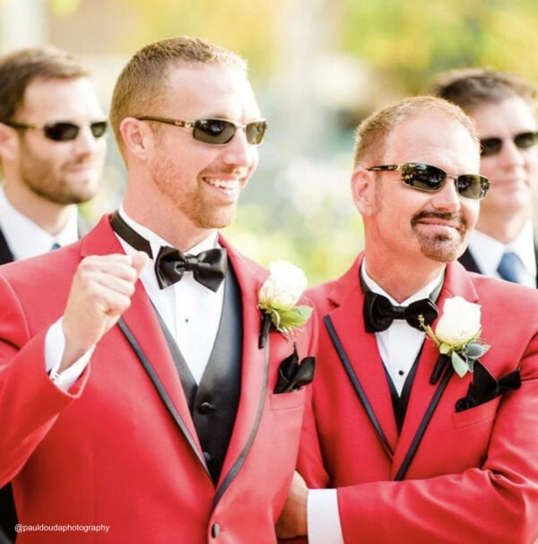 two men wearing red tuxedo rentals from national tuxedo rentals