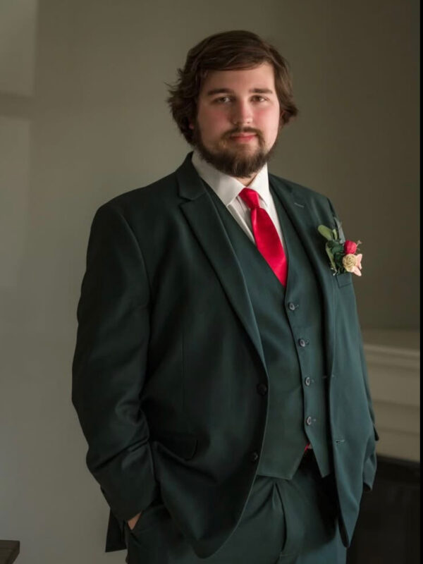 greensuitgroom | National Tuxedo Rentals groom wearing green suit rental with red tie