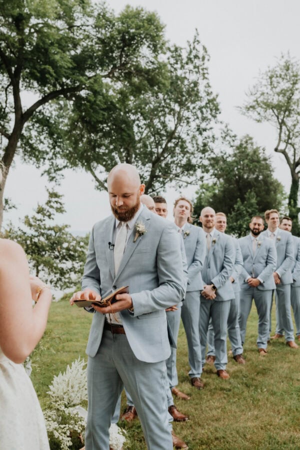 Groom wearing oxford blue suit rental