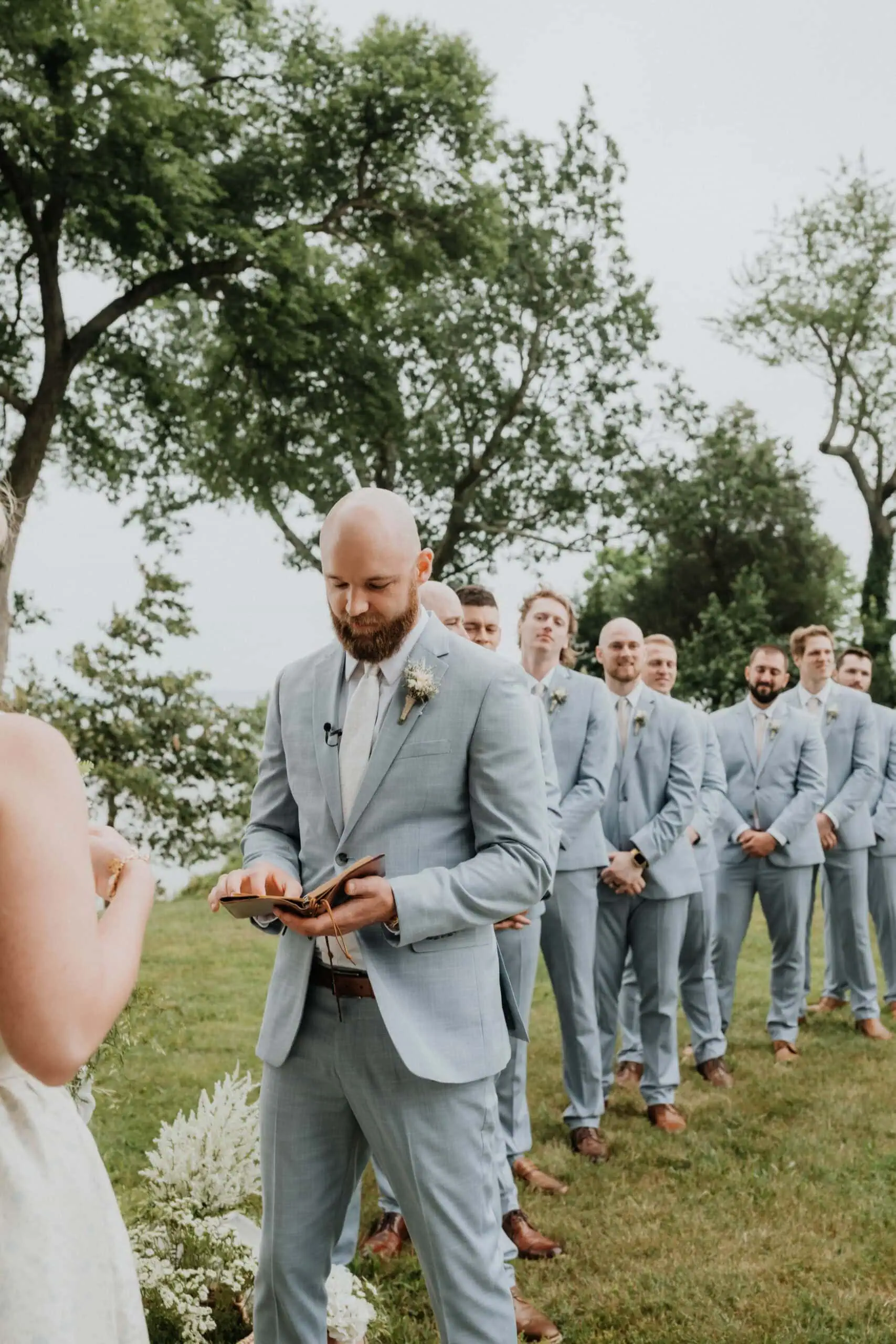 HuckeWedding-1304 | National Tuxedo Rentals Groom wearing oxford blue suit rental