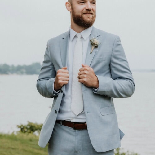 Groom wearing oxford blue suit rental