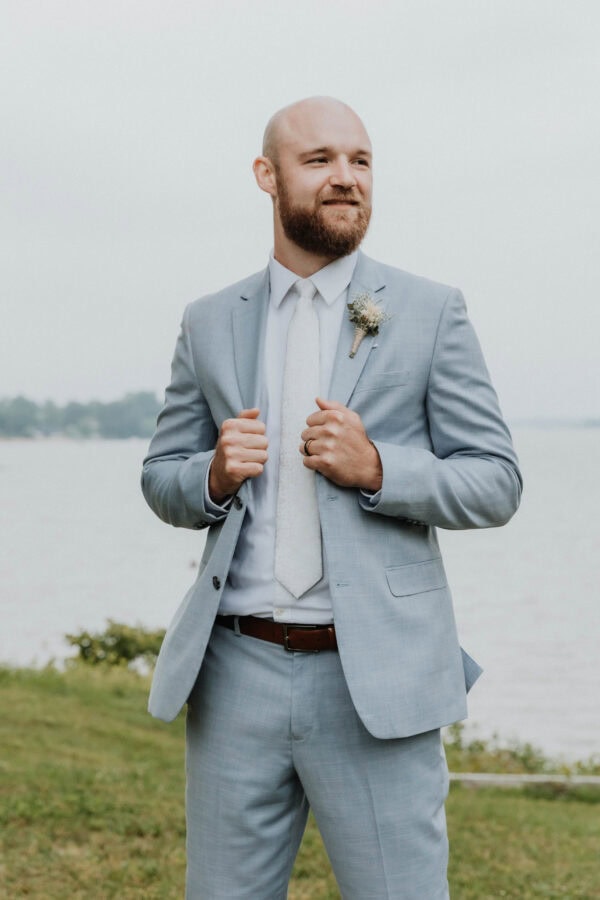 Groom wearing oxford blue suit rental