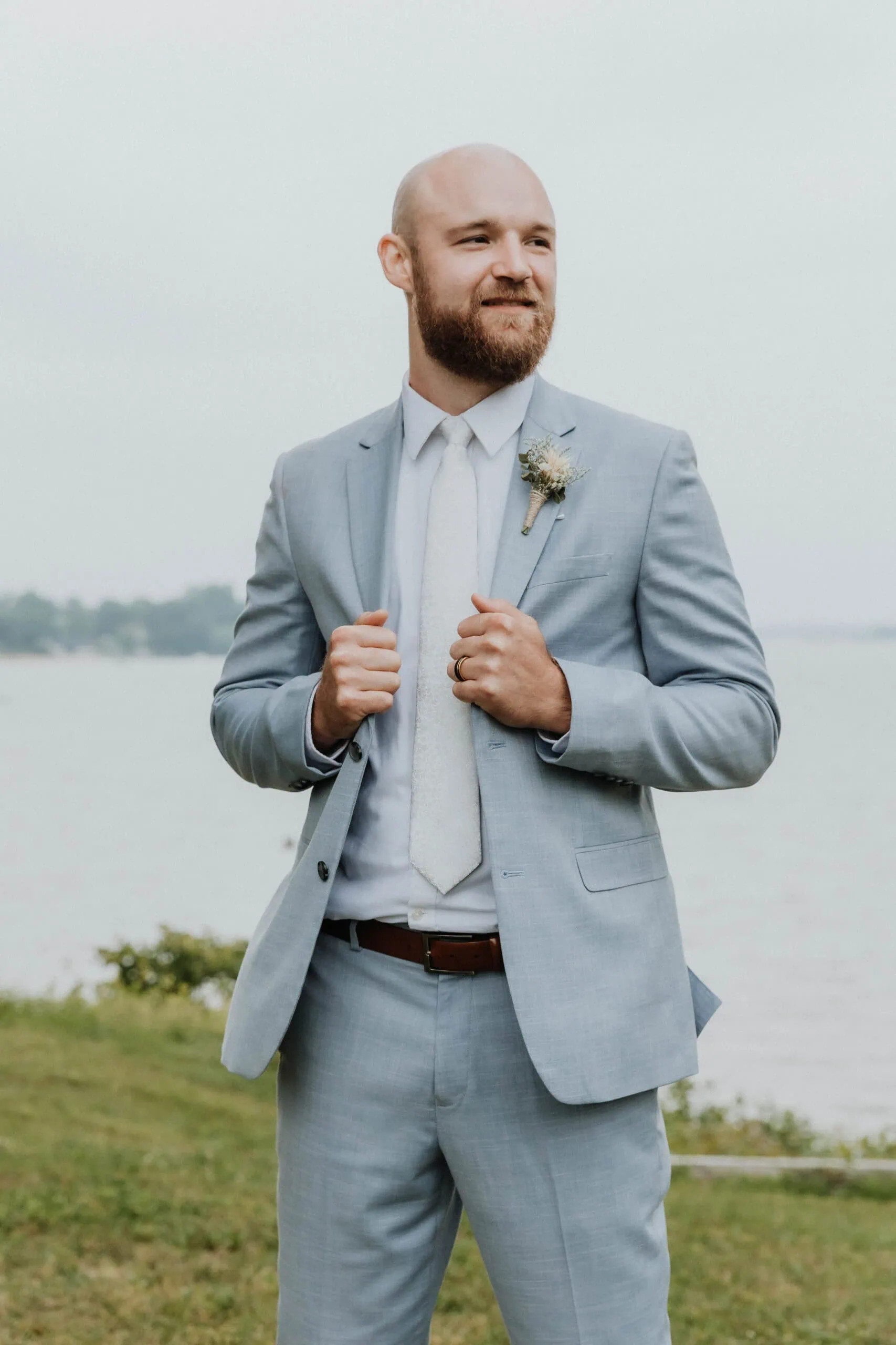 HuckeWedding-1904 | National Tuxedo Rentals Groom wearing oxford blue suit rental