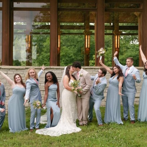 wedding party in blue suits and dresses