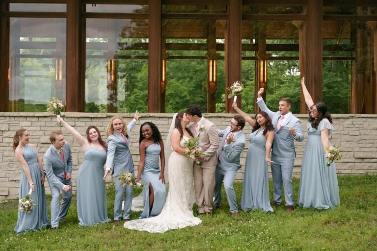 wedding party in blue suits and dresses