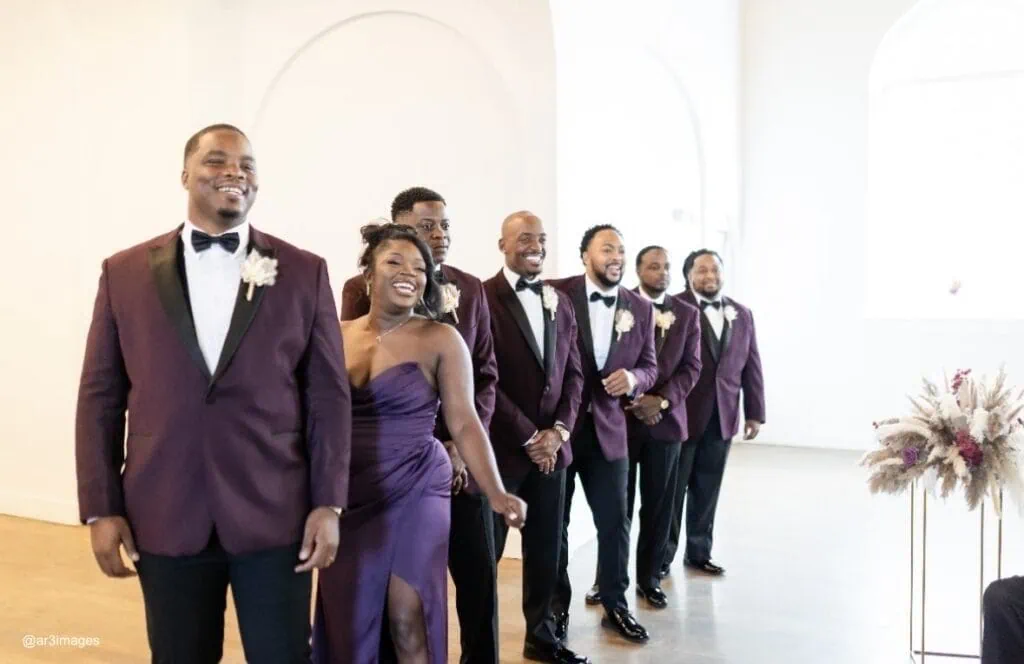 wedding party in plum tuxedos