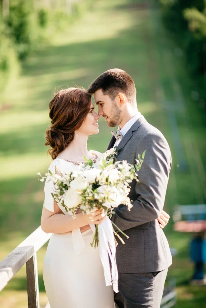 man in grey suit rental with bride