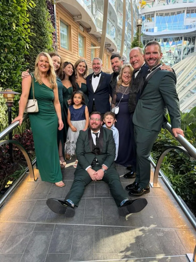 wedding party wearing green tuxedo rentals