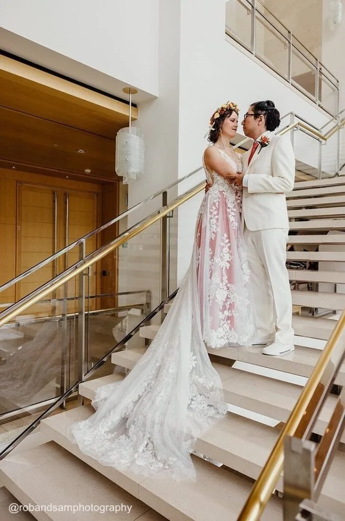 bride and groom on stairs at reception