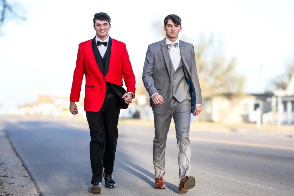 two friends walking in tuxedo rentals before prom