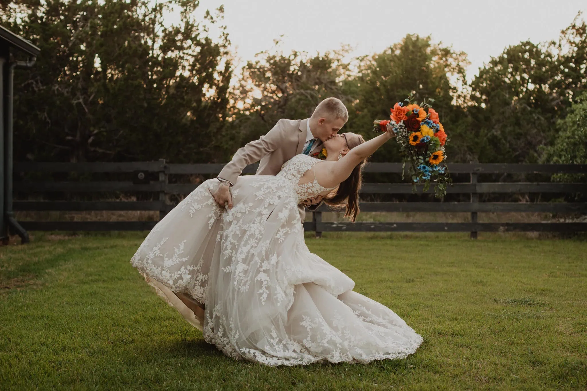 groom dipping bride after wedding