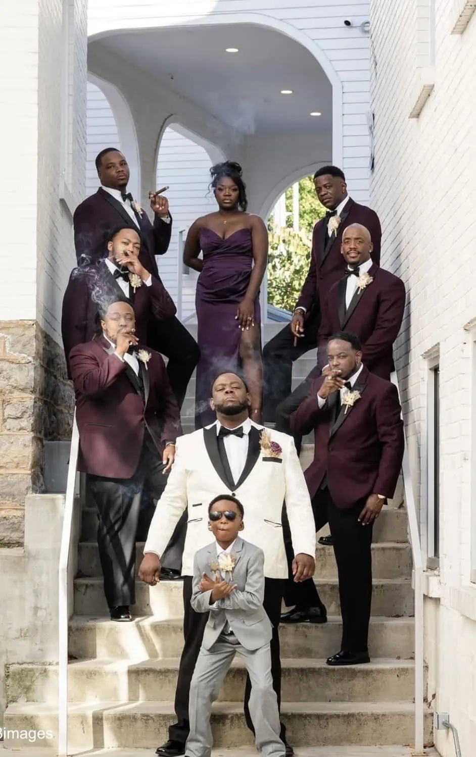 groomsmen in plum tuxedo rentals