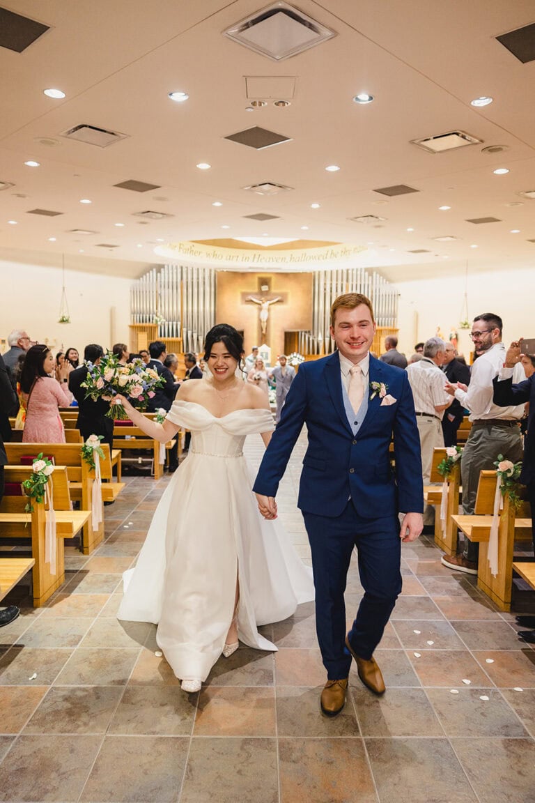 Jennifer Andrew Wedding Day | National Tuxedo Rentals bride and groom walking down aisle
