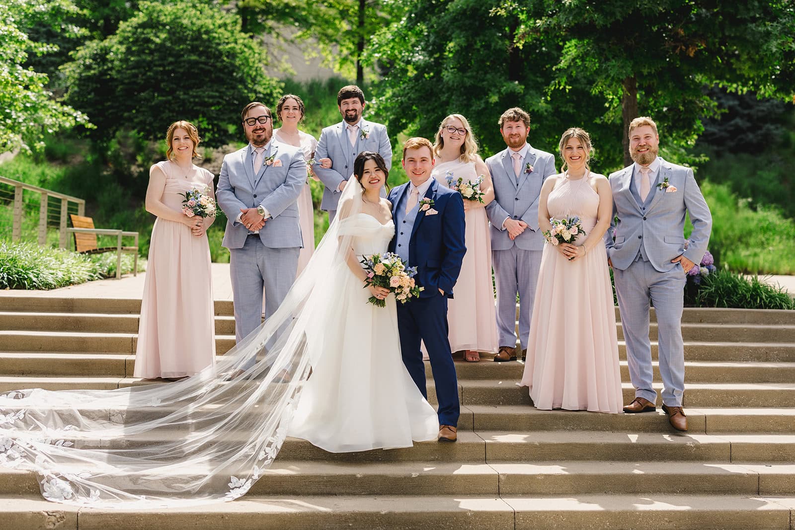 Jennifer Andrew Wedding Day bridal party posing on stairs outdoors