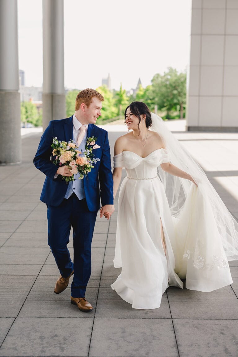 Jennifer Andrew Wedding Day | National Tuxedo Rentals bride and groom walking after ceremony