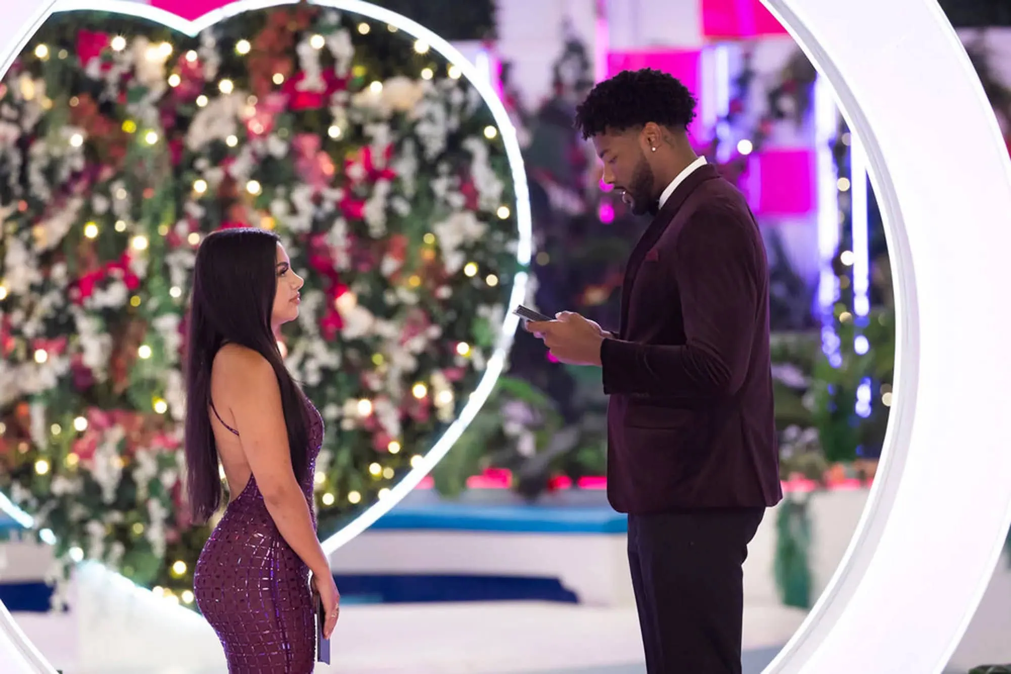 Love-Island-USA-Season-7-071325-12-52aedd9bbf5e4e39ab26149556449053 chris from love island wearing a burgundy tuxedo