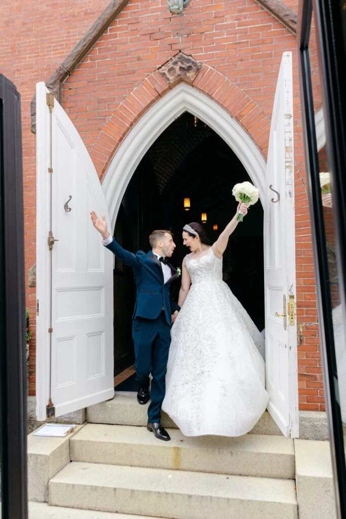 bride and groom exiting the venue