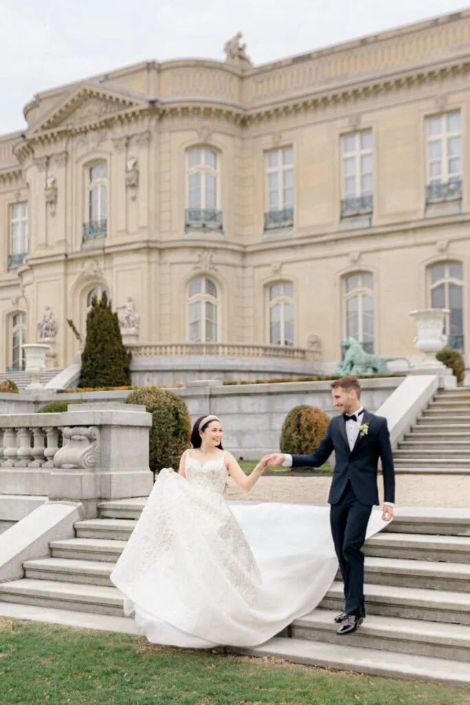 bride and groom walking down outdoor stairway