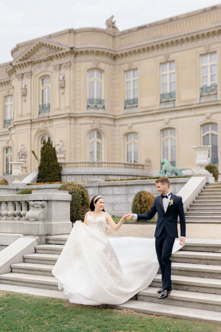 bride and groom walking down outdoor stairway