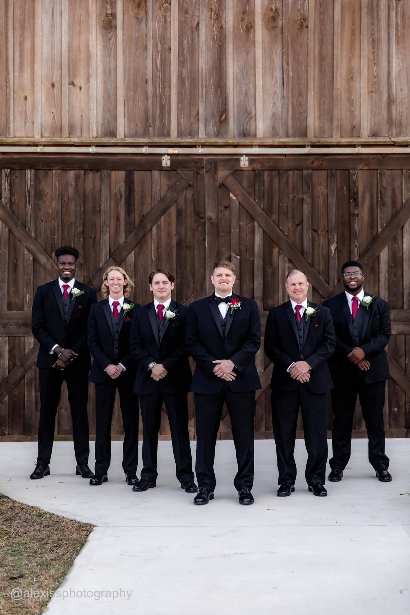 groom and groomsmen in black tuxedo rentals