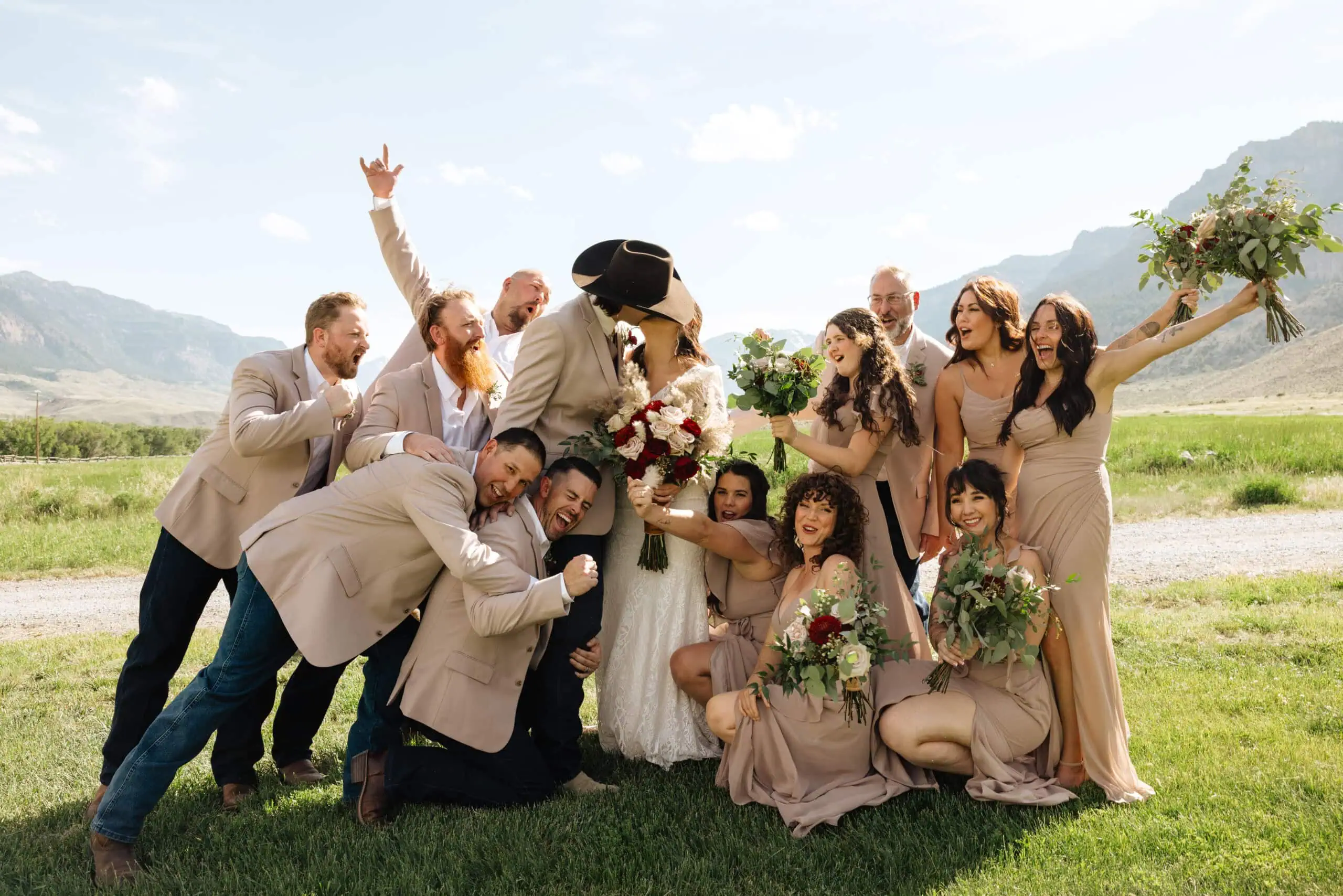 Mr Mrs Donald country wedding group wearing tan suits