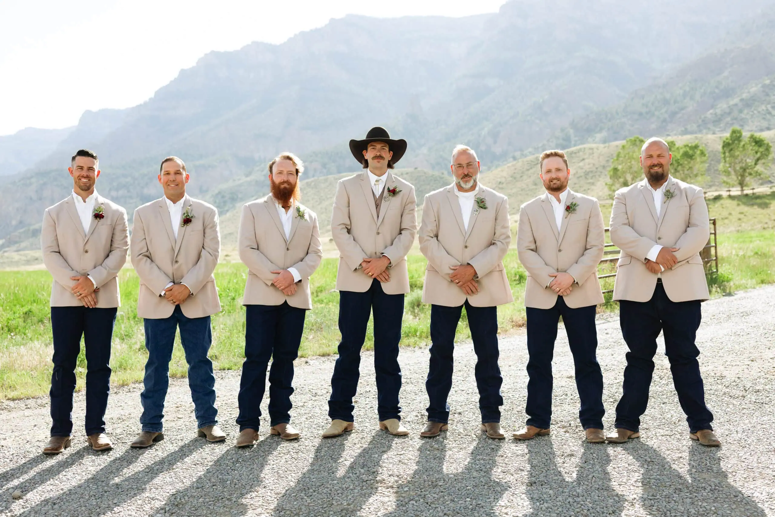 wedding party in tan suit rentals