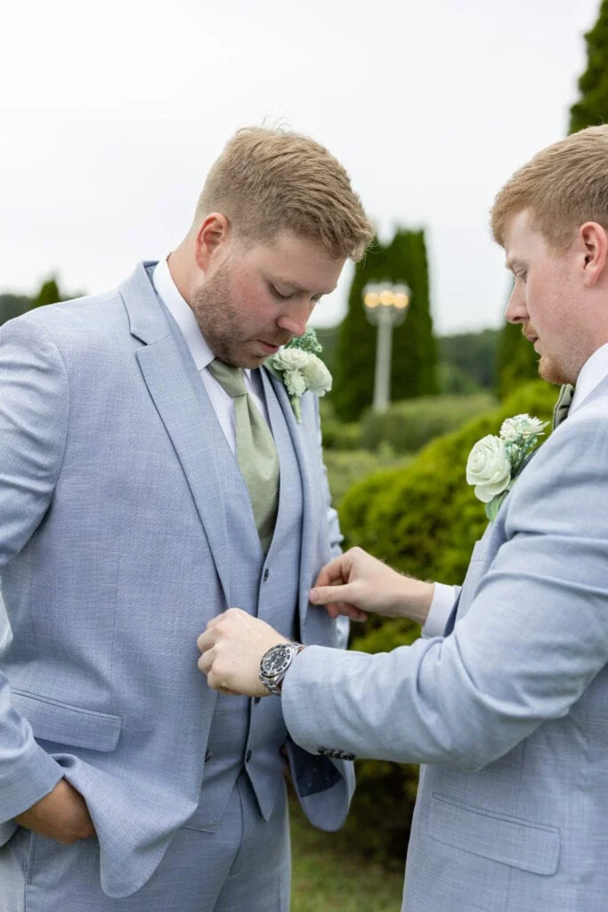 groom and groomsmen wearing blue suit rental