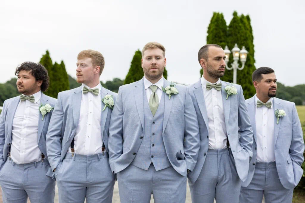 groom and groomsmen wearing blue suit rental