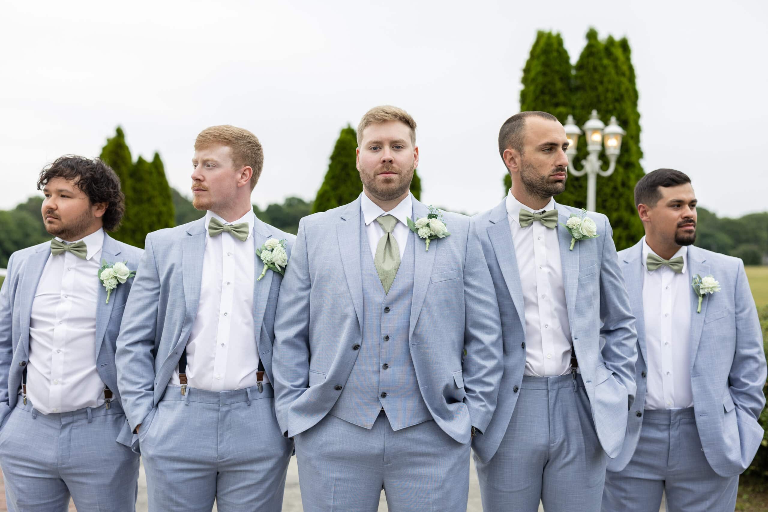 groom and groomsmen wearing blue suit rental