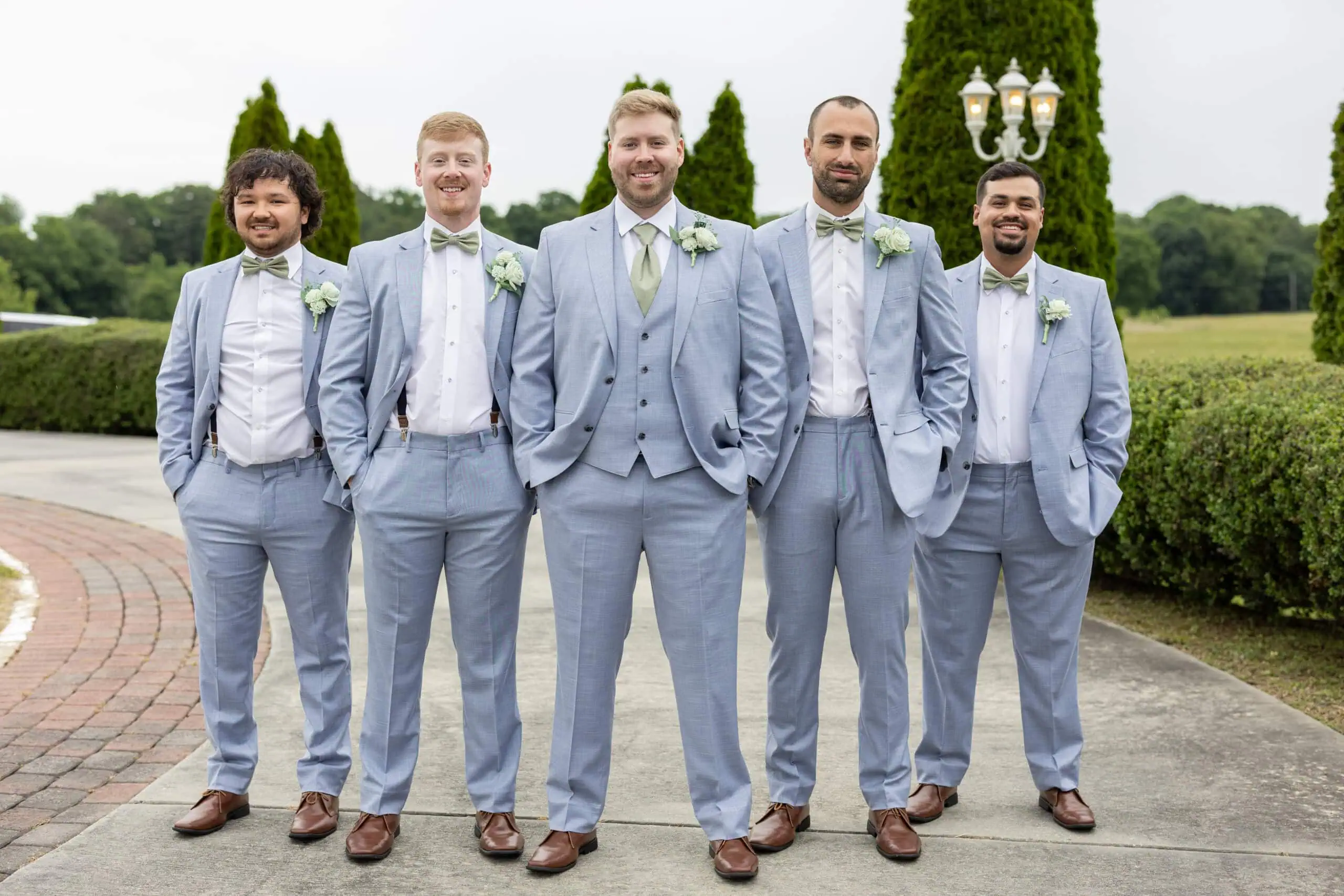 groom and groomsmen wearing blue suit rental