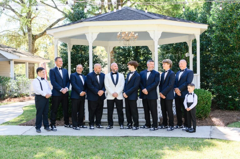 wedding party wearing navy blue tuxedo rentals