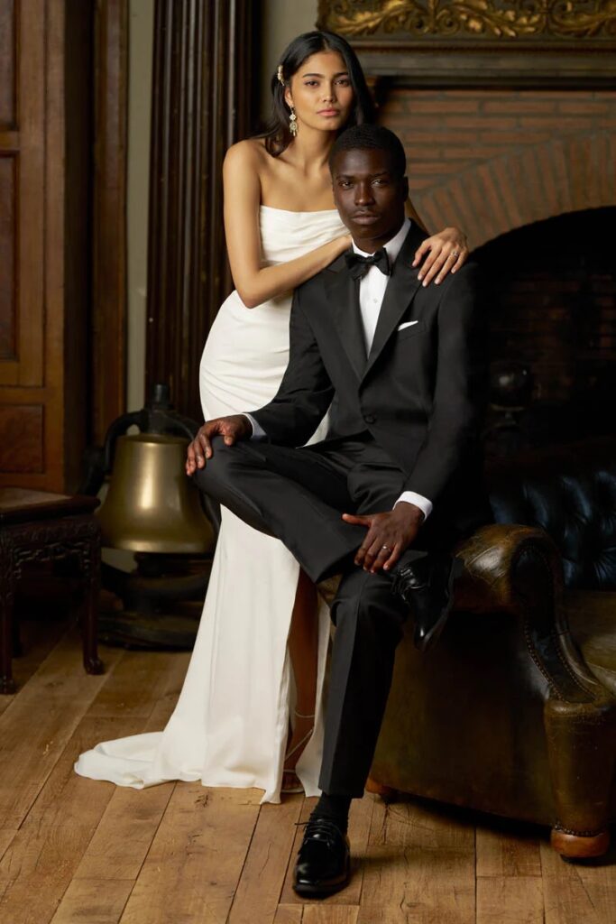 man wearing black tuxedo standing with woman in dress