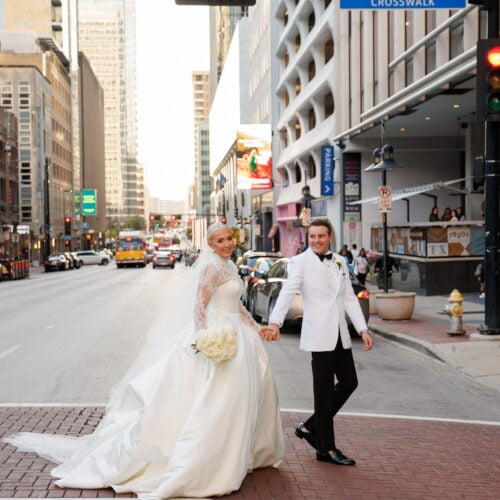 bride and groom walking in city