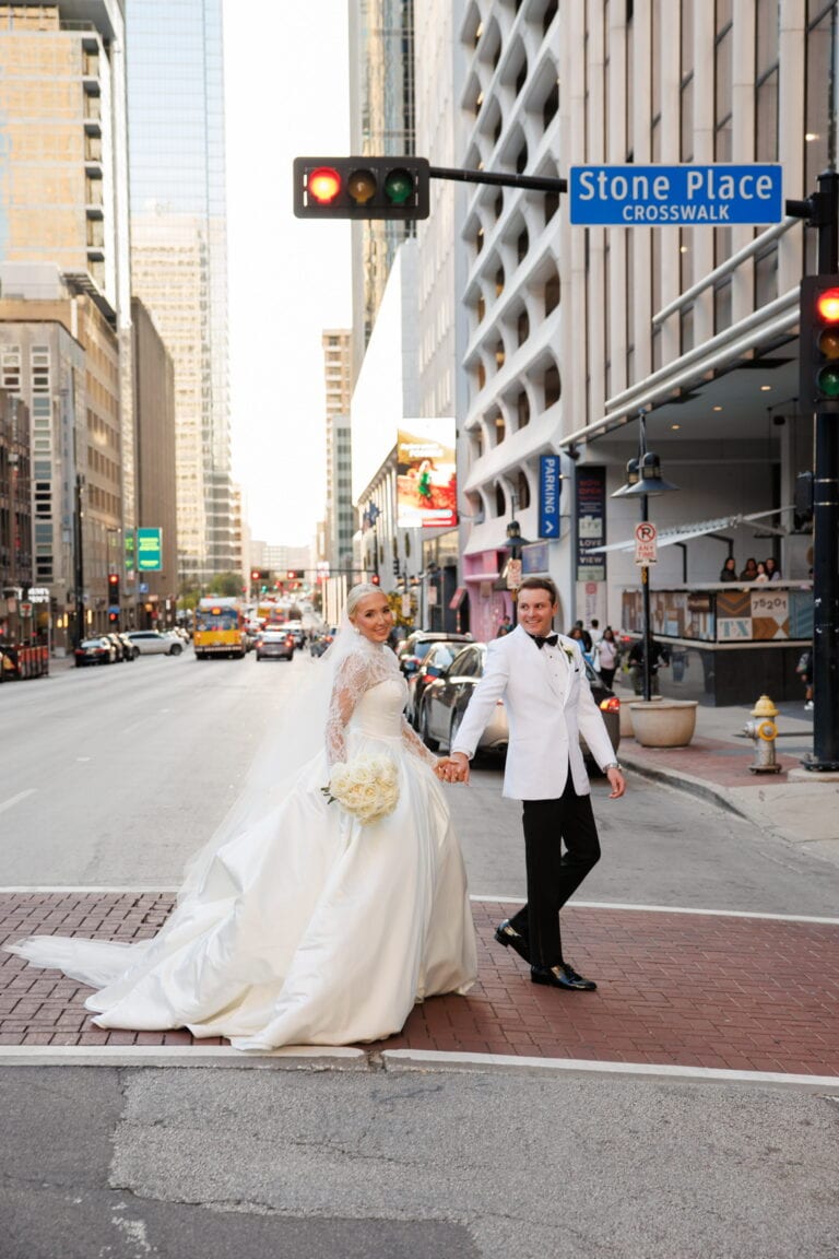 bride and groom walking in city