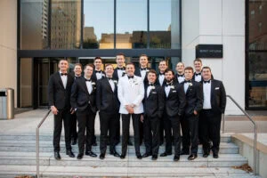 Groom and groomsmen pose for wedding
