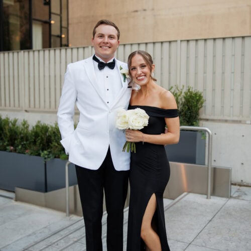 groom wearing white tuxedo rental
