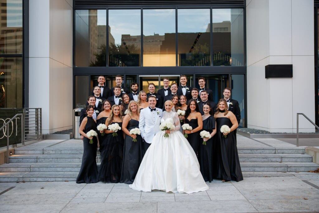 wedding party in black tuxedo rentals