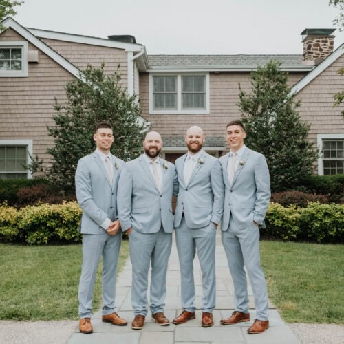 four groomsmen in oxford blue suit rentals