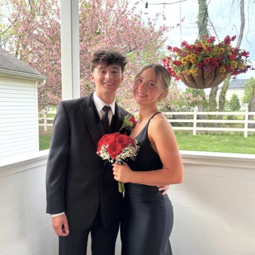 prom couple posing outdoors