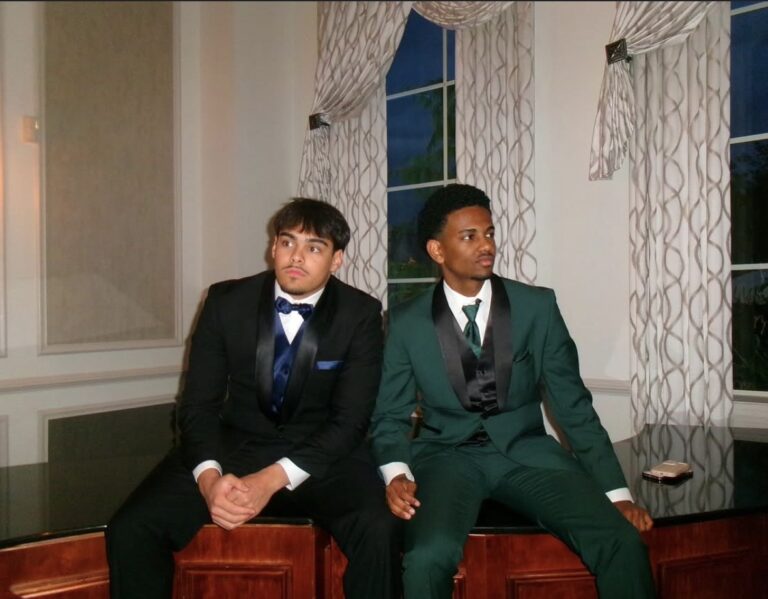 promtuxedos | National Tuxedo Rentals friends sitting at prom in tuxedos
