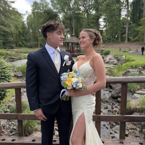 prom couple wearing tuxedo