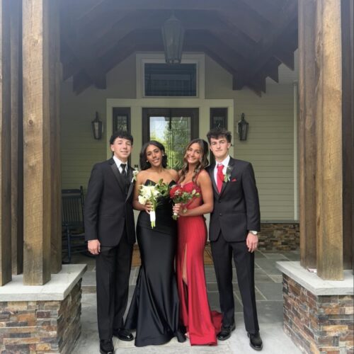 group of prom couples dressed up